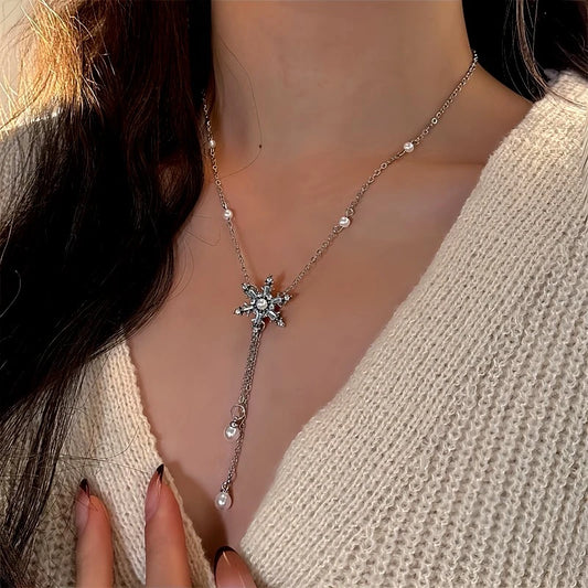 14K Gold-Plated Christmas Snowflake Pearl Tassel Necklace worn to showcase its length and pendant detail