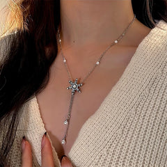 14K Gold-Plated Christmas Snowflake Pearl Tassel Necklace worn to showcase its length and pendant detail
