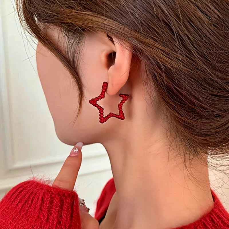 Close-up detail of the sparkling zircons and plating on the Christmas Star Earrings