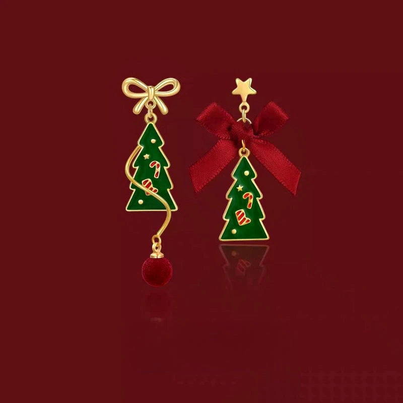 Model showcasing the dangle and style of the 14K Gold-Plated Christmas Tree Bow Earrings