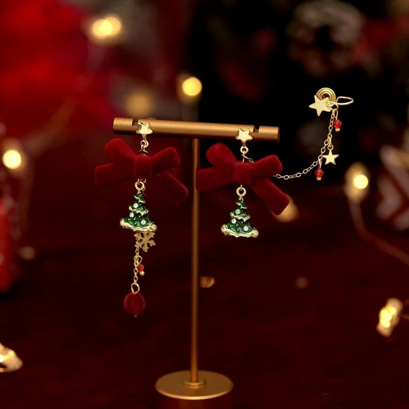 Model showcasing the dangle and style of the 14K Gold-Plated Christmas Tree Ear Bone Clip Earrings