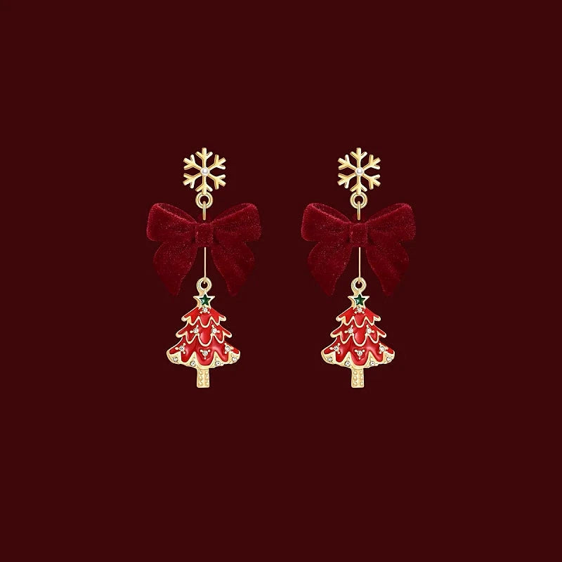 Angled view of the 14K Gold-Plated Christmas Tree Snowflake Bow Earrings