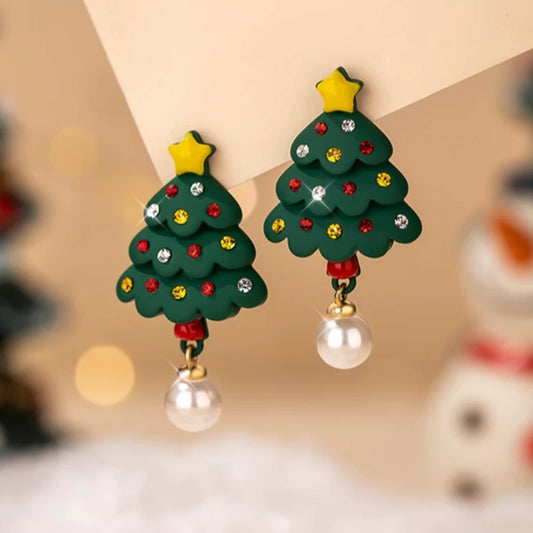 Model showcasing the dangle and style of the 14K Gold-Plated Christmas Tree Star Pearl Earrings