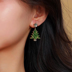 Model showcasing the dangle and style of the 14K Gold-Plated Christmas Tree Zircon Star Earrings