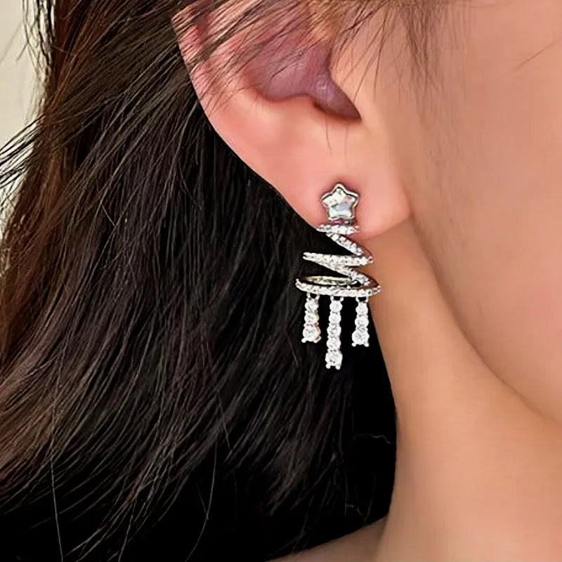 Model showcasing the dangle and style of the 14K Gold-Plated Christmas Tree Zircon Tassel Earrings