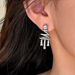 Model showcasing the dangle and style of the 14K Gold-Plated Christmas Tree Zircon Tassel Earrings