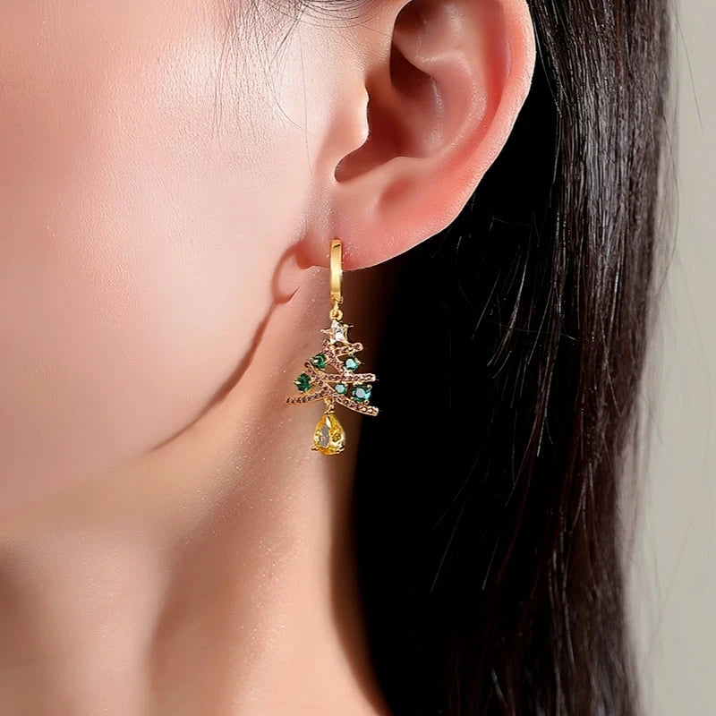 Model showcasing the dangle and style of the 14K Gold-Plated Christmas Zircon Colored Christmas Tree Earrings