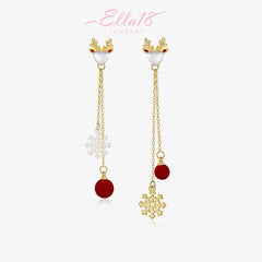 Model showcasing the dangle and style of the 14K Gold-Plated Christmas Zircon Deer Snowflake Tassel Earrings