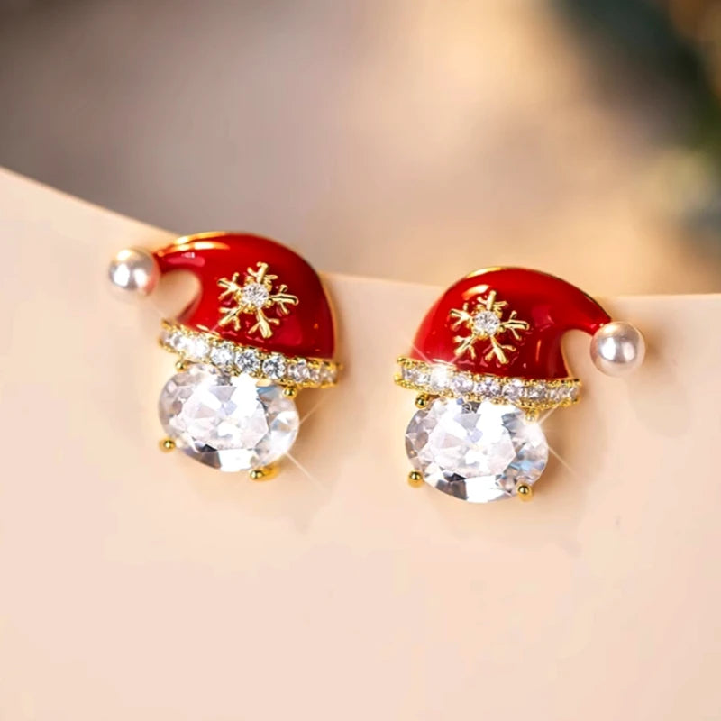 Model showcasing the dangle and style of the 14K Gold-Plated Christmas Zircon Hat Earrings