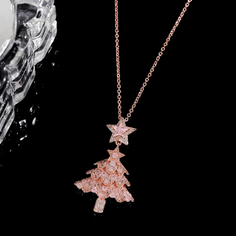 Close-up of the pendant and clasp on the Pink Christmas Tree Necklace