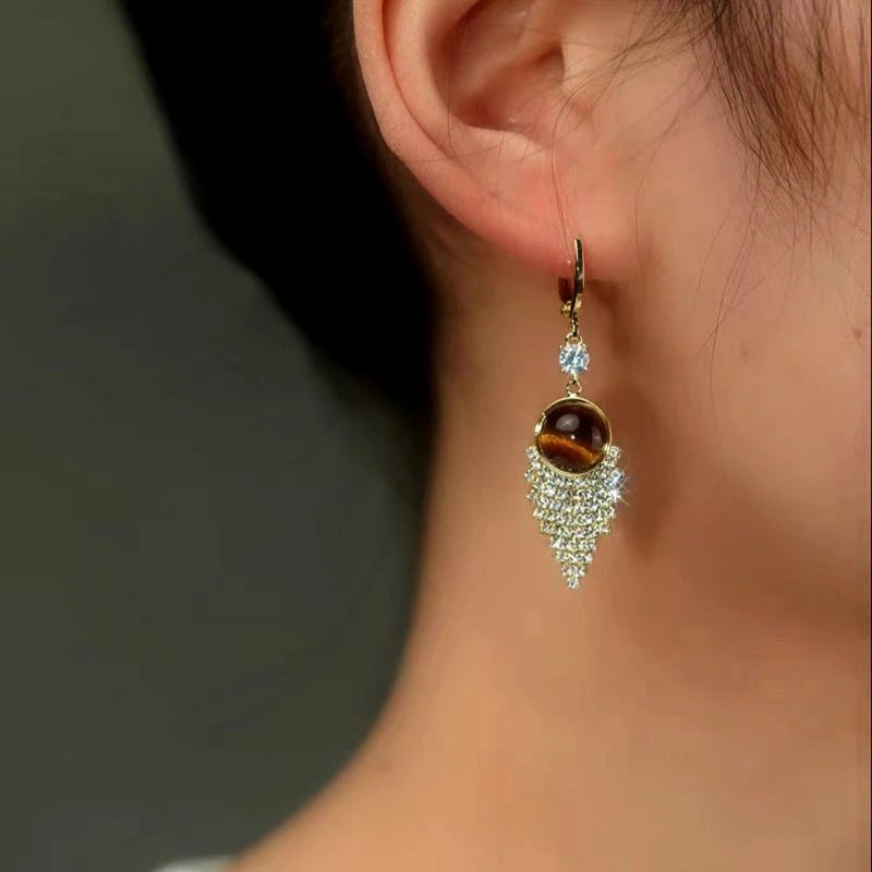 Close-up detail of the sparkling zircons and plating on the Brown Tassel Earrings