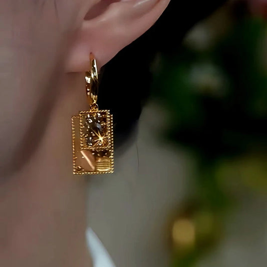 Model showcasing the dangle and style of the 14K Gold-Plated Coffee Color Full Diamond Square Crystal Earrings