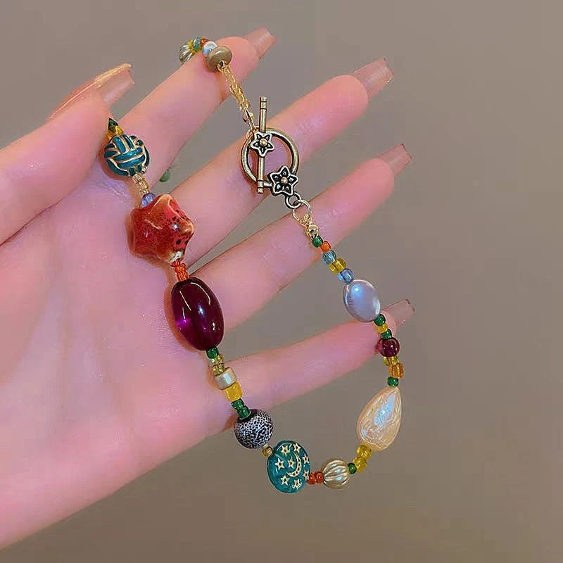 Close-up of the pendant and clasp on the Beaded Star Necklace