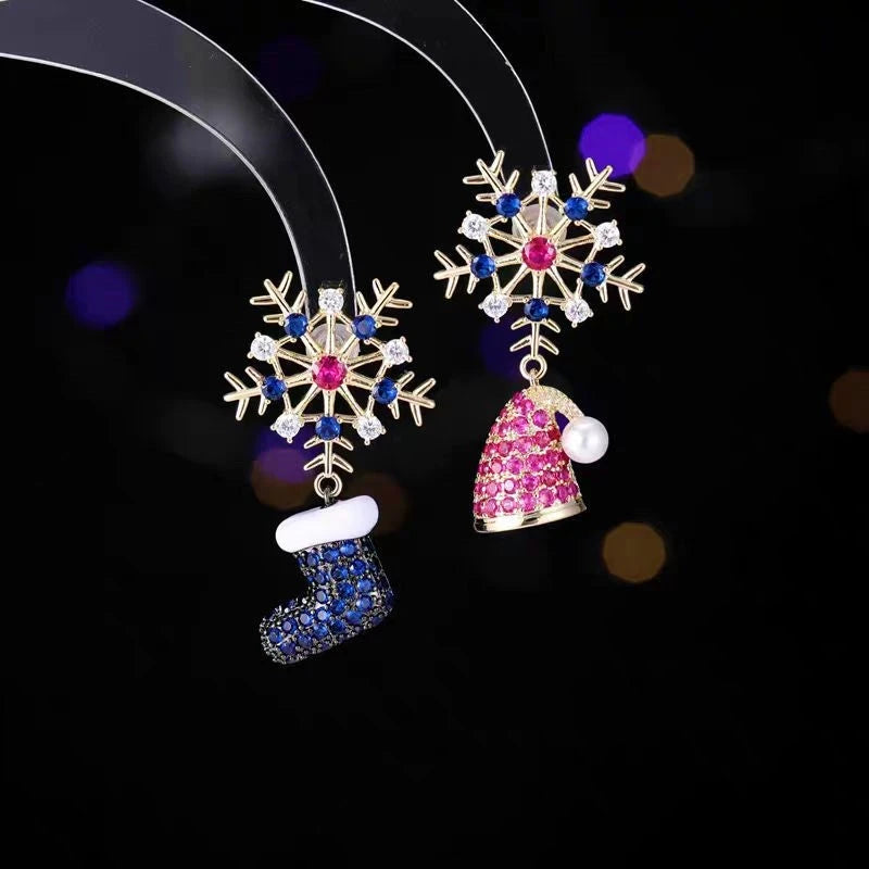 Model showcasing the dangle and style of the 14K Gold-Plated Colorful Christmas Snowflake Boots Hat Earrings