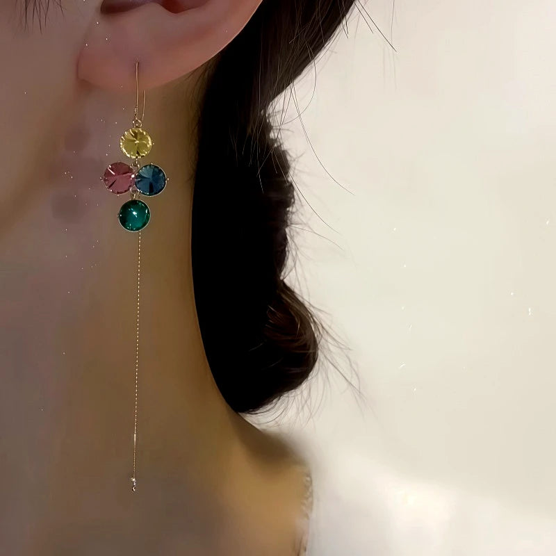 Model showcasing the dangle and style of the 14K Gold-Plated Colorful Diamond Threader Earrings