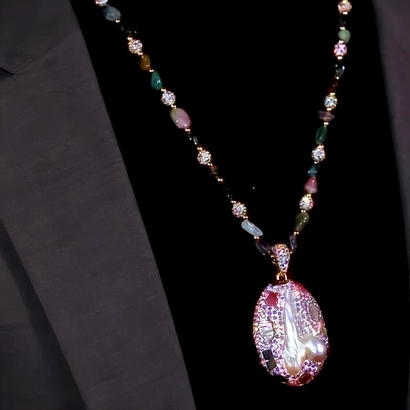 Close-up of the pendant and clasp on the Round Sweater Necklace