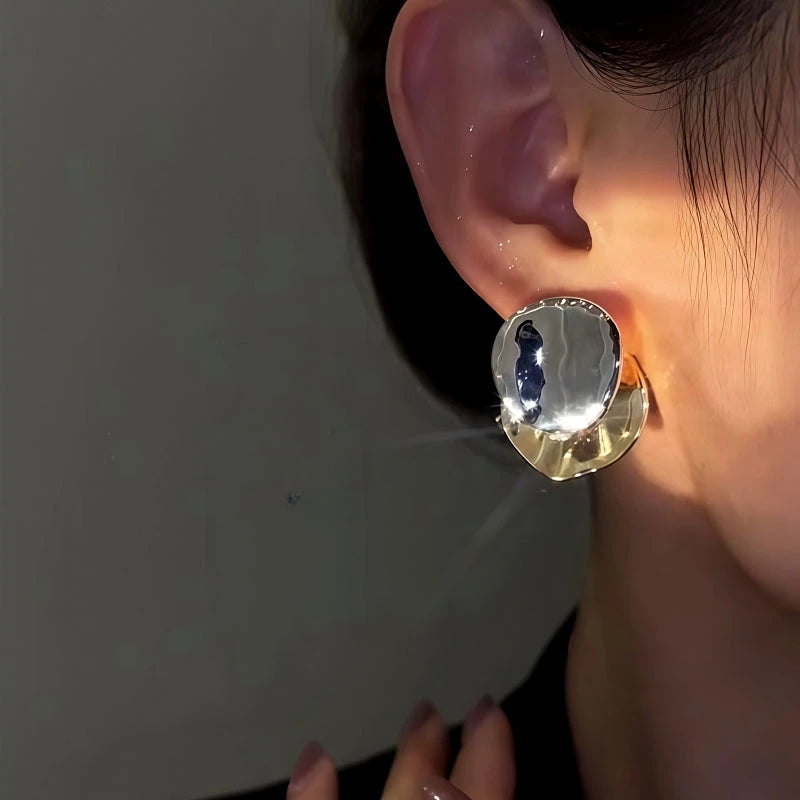 Model showcasing the dangle and style of the 14K Gold-Plated Contrast Disc Earrings
