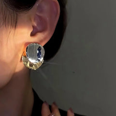 Close-up detail of the sparkling zircons and plating on the Contrast Disc Earrings