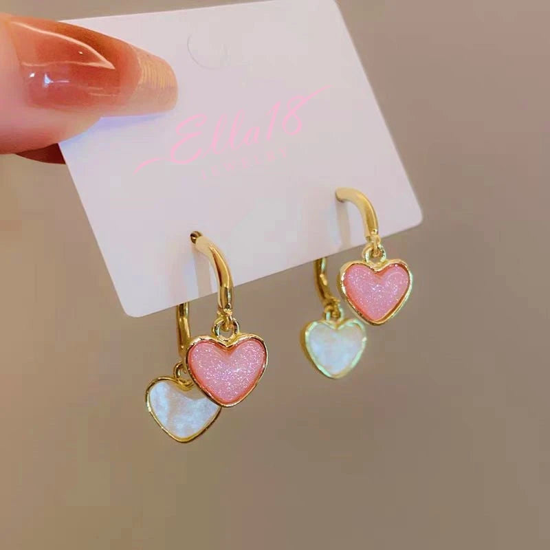 Angled view of the 14K Gold-Plated Contrasting Heart Earrings