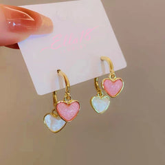 Angled view of the 14K Gold-Plated Contrasting Heart Earrings