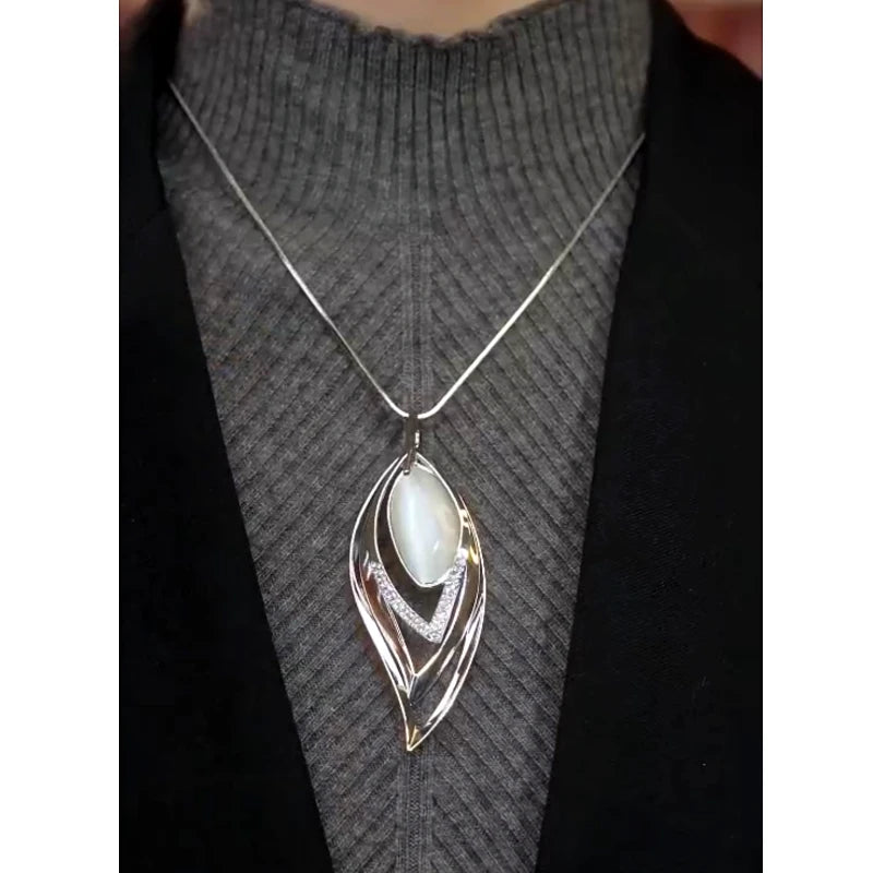 Close-up of the pendant and clasp on the Leaf Sweater Necklace