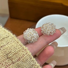 Angled view of the 14K Gold-Plated Crystal Flower Stud Earrings