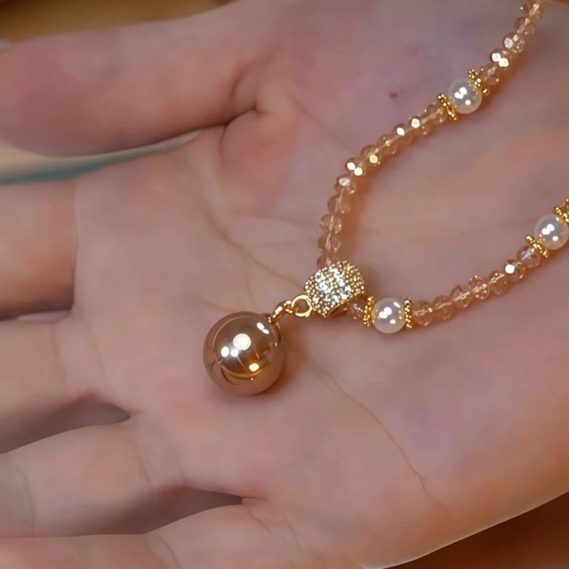 Close-up of the pendant and clasp on the Crystal Pearl Necklace