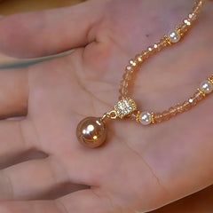 Close-up of the pendant and clasp on the Crystal Pearl Necklace