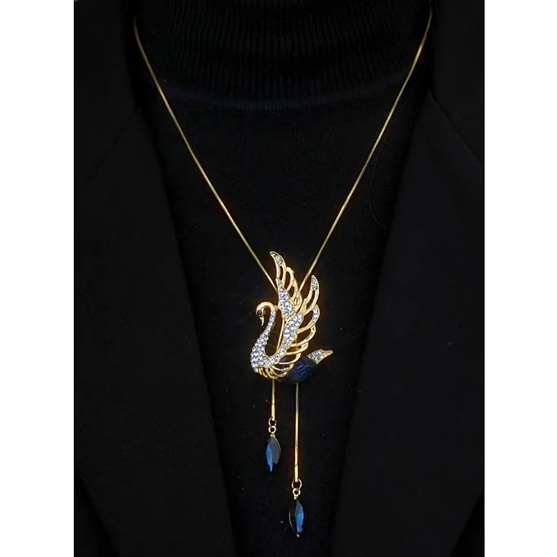 Detailed view of the 14K Gold-Plated Crystal Swan Sweater Necklace chain and pendant