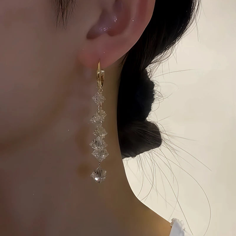 Close-up detail of the sparkling zircons and plating on the Crystal Tassel Earrings