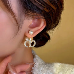 Close-up detail of the sparkling zircons and plating on the Bead Jacket Earrings