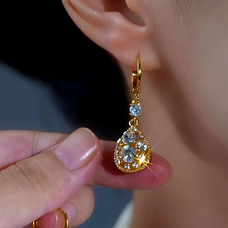 Model showcasing the dangle and style of the 14K Gold-Plated Daimond Water Drop Earrings