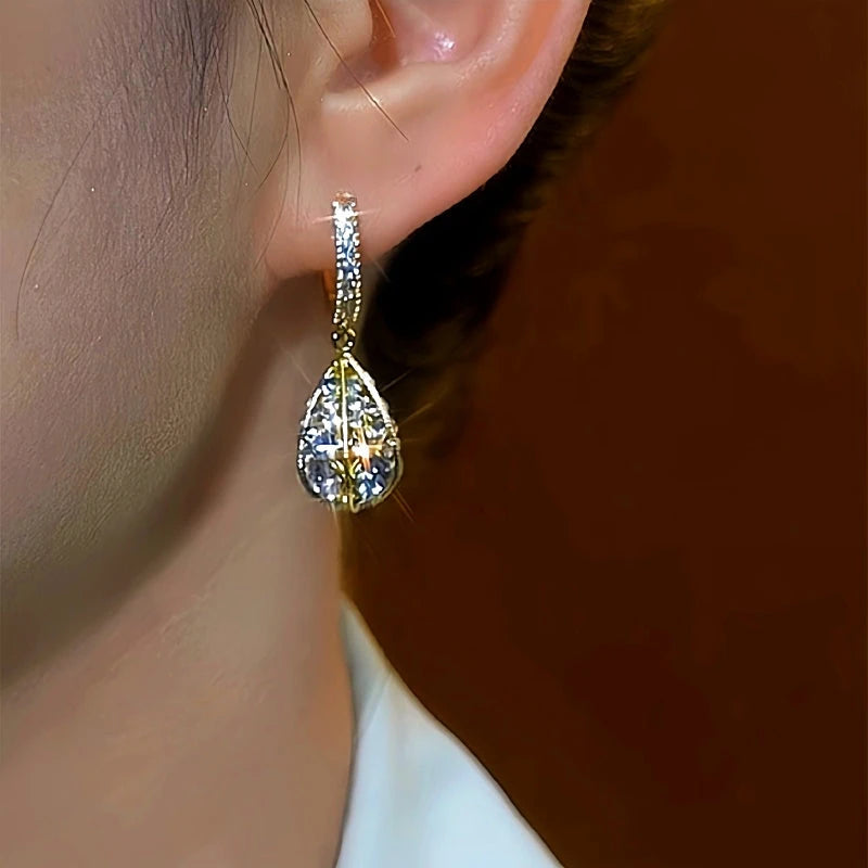 Model showcasing the dangle and style of the 14K Gold-Plated Daimond Water Drop Earrings