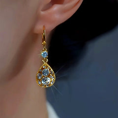 Close-up detail of the sparkling zircons and plating on the Red Water Drop Earrings