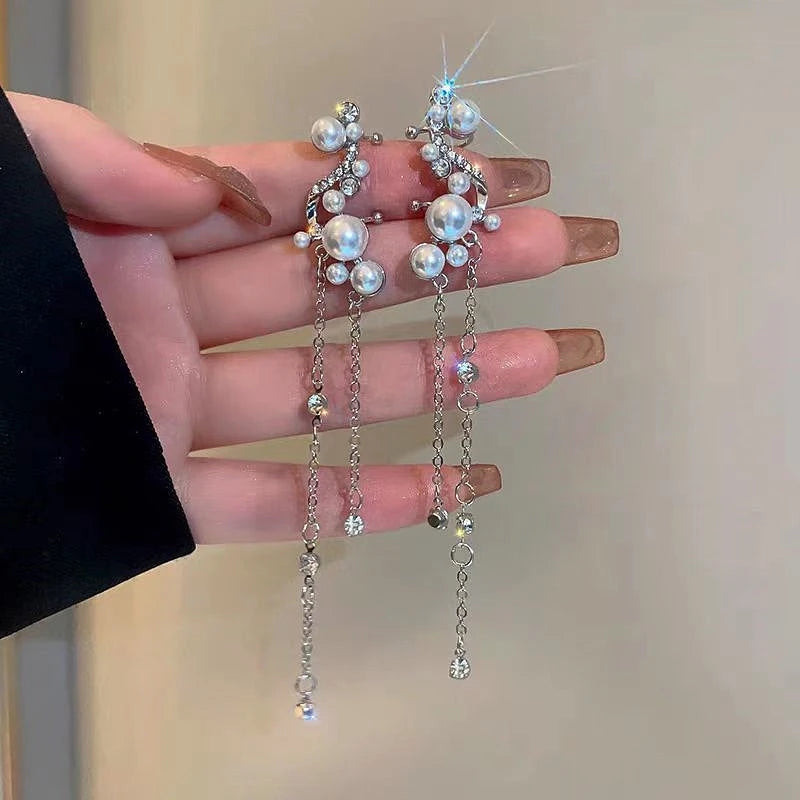 Angled view of the 14K Gold-Plated Diamond-Studded Tassel Ear Bone Clip Earrings