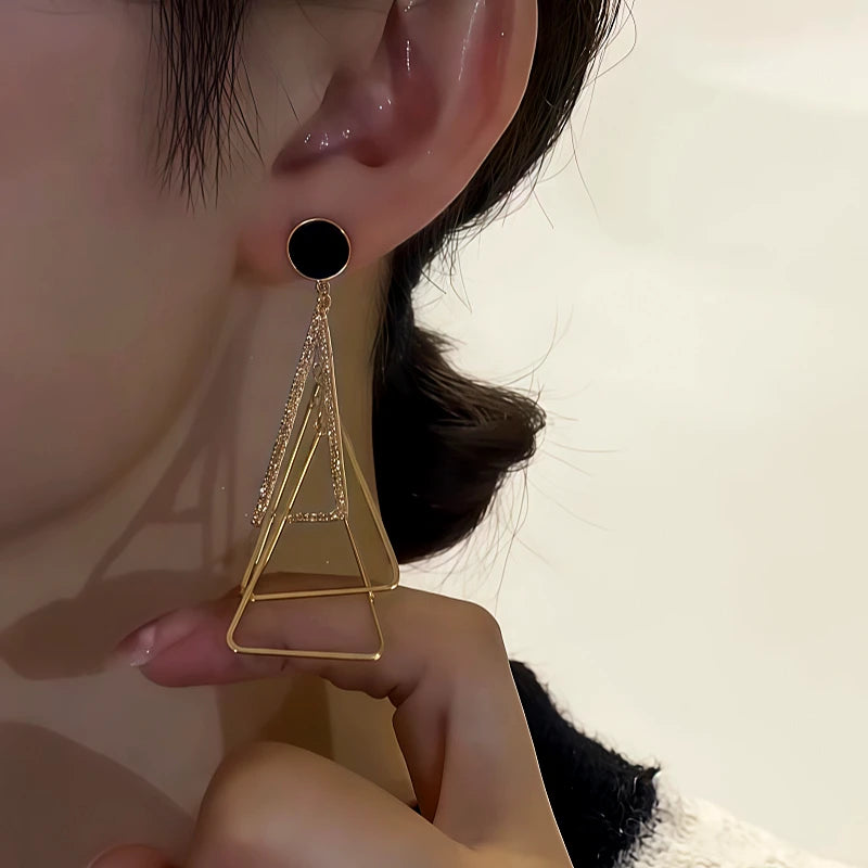 Close-up detail of the sparkling zircons and plating on the Triangle Earrings