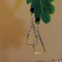 Angled view of the 14K Gold-Plated Diamond-Studded Three-Dimensional Multi-Layer Triangle Earrings