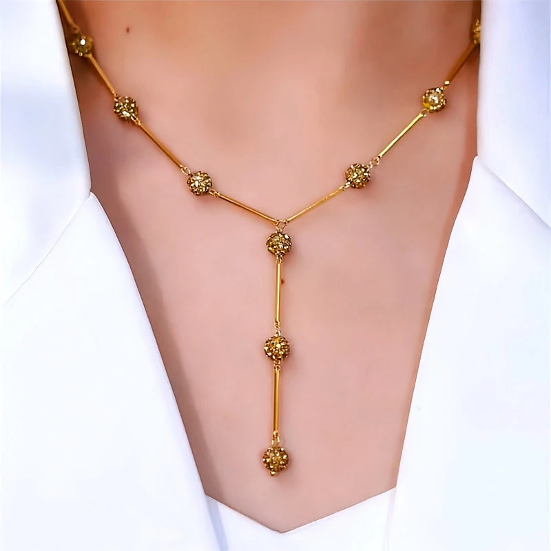 14K Gold-Plated Diamond-Studded Y-Shaped Coffee-Colored Diamond Ball Necklace worn to showcase its length and pendant detail