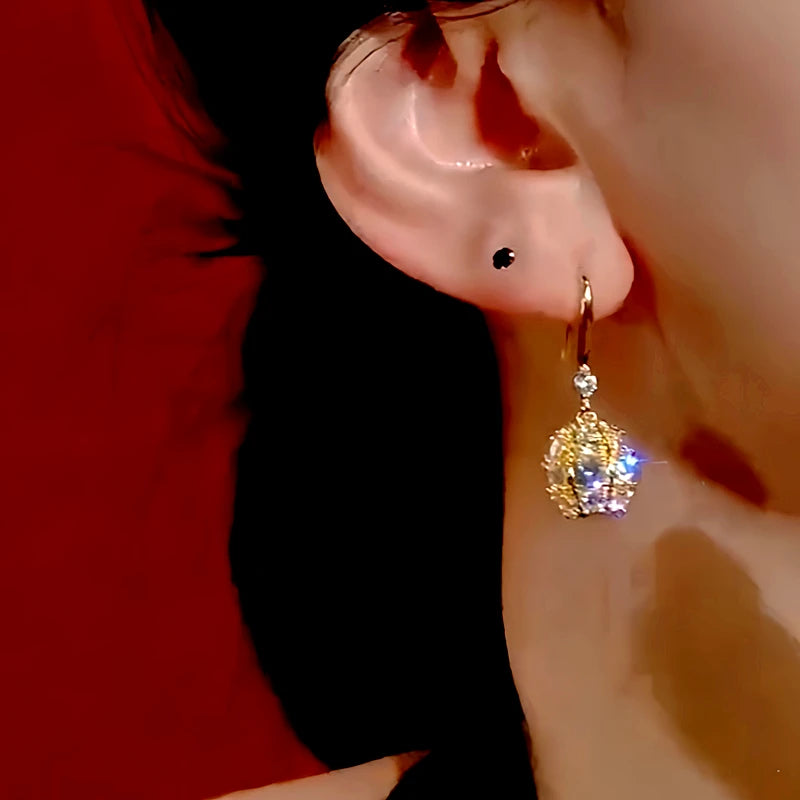 Close-up detail of the sparkling zircons and plating on the Ball Ear Hook Earrings