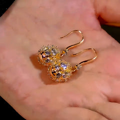 Angled view of the 14K Gold-Plated Diamond Ball Ear Hook Earrings