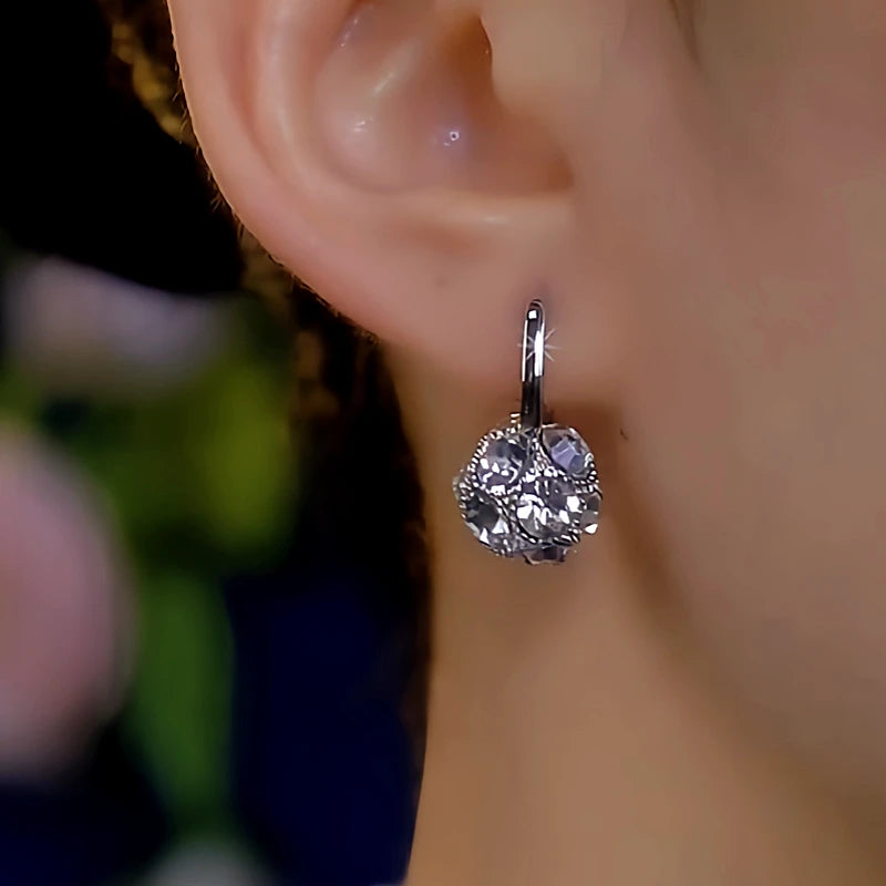 Close-up detail of the sparkling zircons and plating on the Silver Diamond Ball Earrings