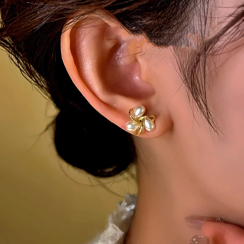 Angled view of the 14K Gold-Plated Diamond Bead Stud Earrings