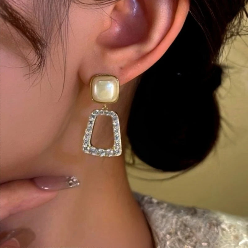 Close-up detail of the sparkling zircons and plating on the Bead Tassel Earrings
