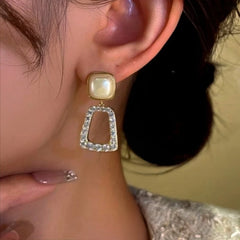 Close-up detail of the sparkling zircons and plating on the Bead Tassel Earrings