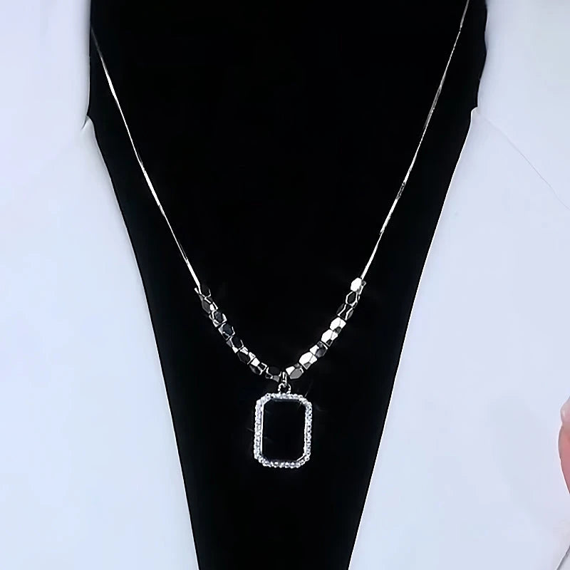 Close-up of the pendant and clasp on the Black Square Necklace