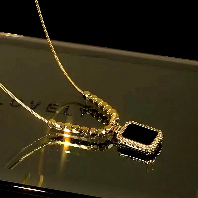 Styling the 14K Gold-Plated Diamond Black Square Necklace with a beautiful outfit