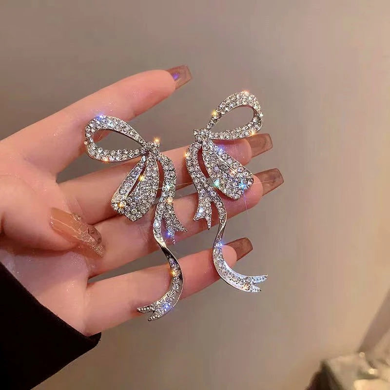 Close-up detail of the sparkling zircons and plating on the Silver Bow Earrings