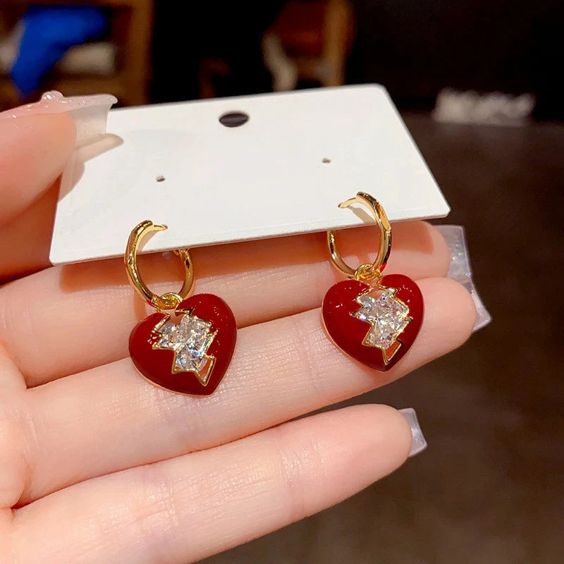 Angled view of the 14K Gold-Plated Diamond Broken Heart Earrings