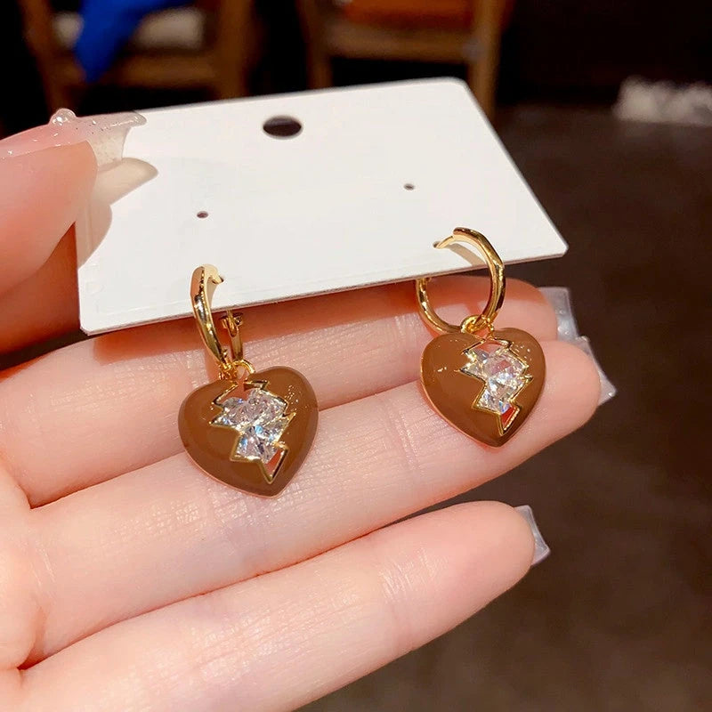 Close-up detail of the sparkling zircons and plating on the Broken Heart Earrings