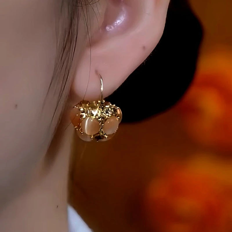 Close-up detail of the sparkling zircons and plating on the Cat's Eye Basket Earrings